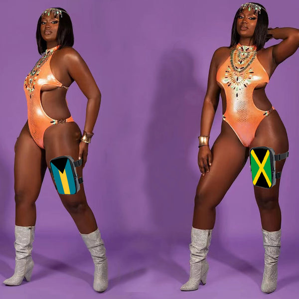 A woman models an orange bodysuit with gold embellishments and black hair, wearing silver boots and a yellow and green watch.