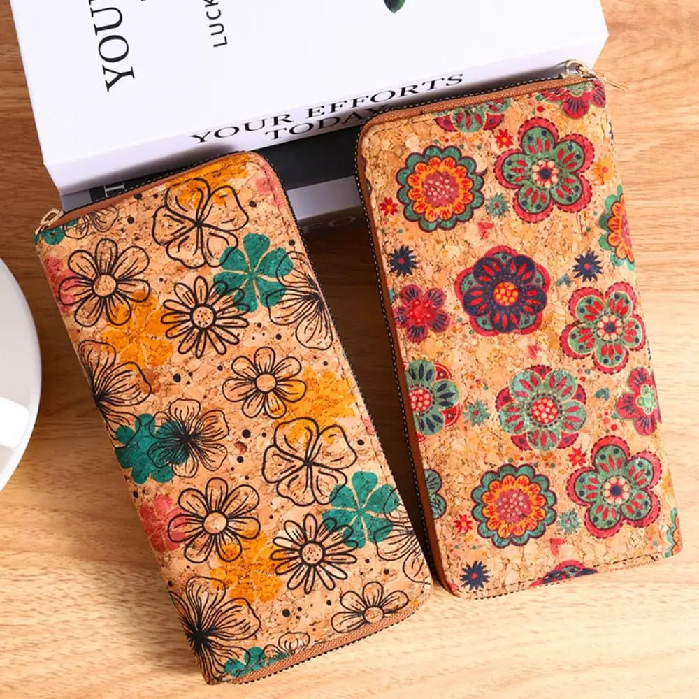 A close-up of a bohemian wood-grain leather wallet with multiple card slots featuring colorful floral patterns.