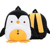 A plush backpack shaped like a penguin with black and white coloring and orange accents.