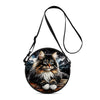 A black cartoon cat round crossbody bag with a long strap.