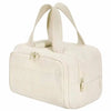 Bolsa impermeable de viaje de color crema con múltiples bolsillos y cierre de cordón.