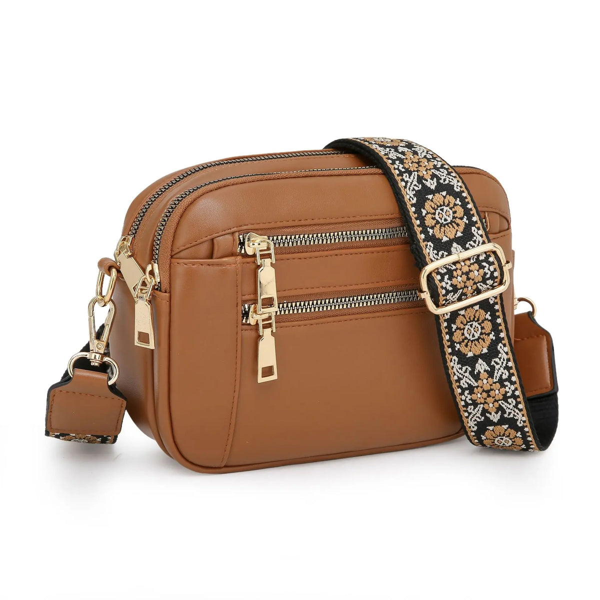 A brown PU leather crossbody bag with gold zippers and a patterned strap is shown against a white background.