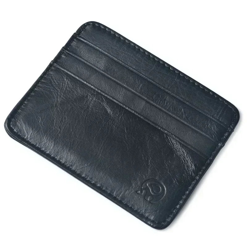 A black genuine leather slim card holder wallet shown from above.