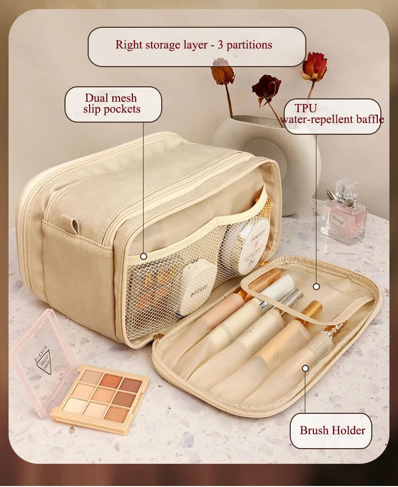 A beige PU leather makeup organizer featuring a right storage layer with three partitions, dual mesh slip pockets, and a brus