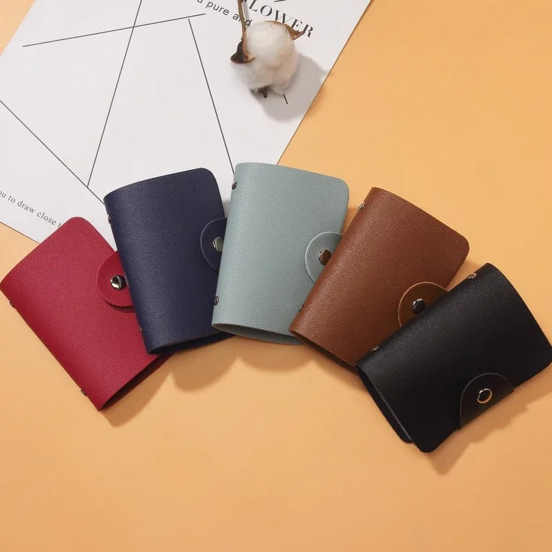 A collection of five premium PU leather ID and credit card wallets in various shades of blue, green, red, brown, and black on