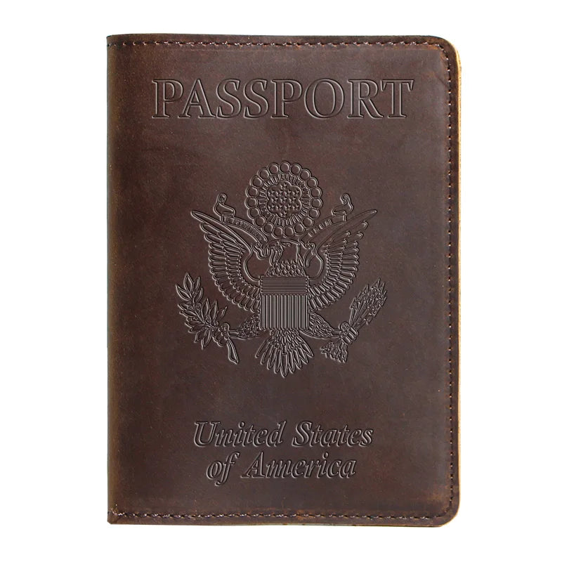 A brown leather passport holder embossed with the words PASSPORT and the seal of the United States of America