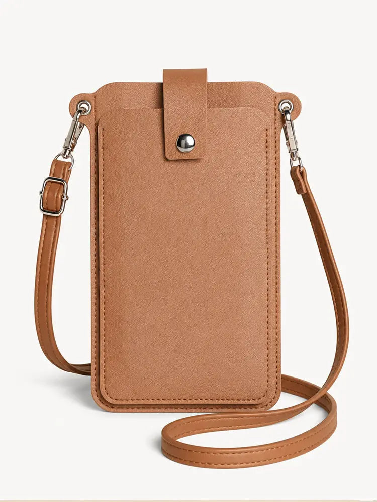 A tan mini PU leather crossbody phone bag with a leather strap and silver hardware.