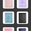 Six color passport holders in pink, purple, teal, black, and navy blue leather.