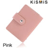 A pink slim leather card holder with a stitched closure is shown against a white background.