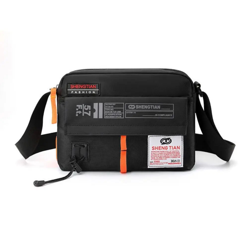 Black waterproof nylon crossbody bag with an orange strap and branding