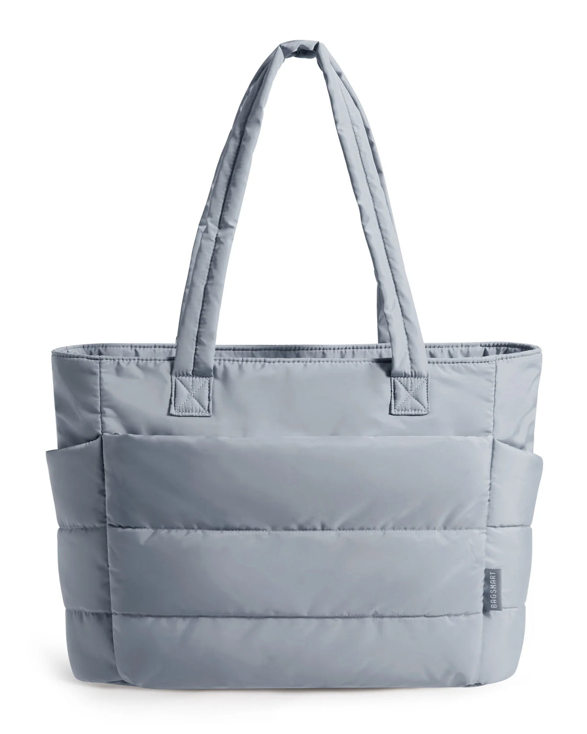 A grey quilted tote bag with padded handles shown from the front.