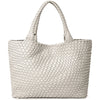 A beige handwoven vegan leather tote bag with a woven texture and a handle.