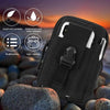 Black tactical EDC utility pouch with a MOLLE strap shown against a sunset background and rocks.