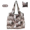 A patterned tote bag featuring a repeating design of cats in various shades of gray and brown.