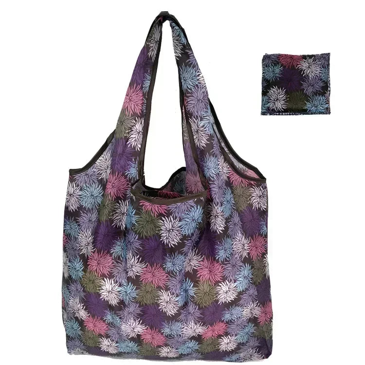 A purple and green floral patterned reusable fashion shopping tote bag.