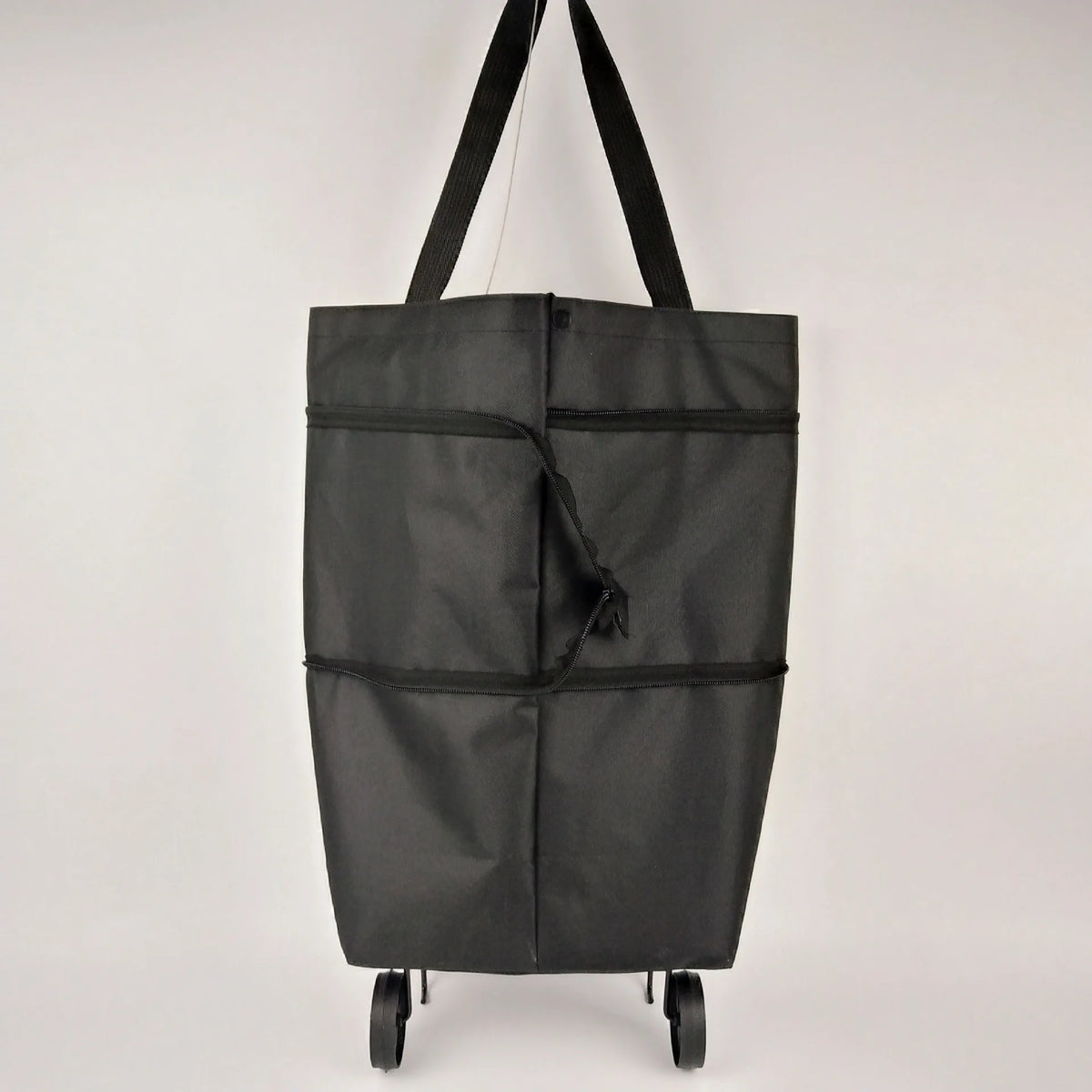 A black foldable grocery and shopping cart with black handles, shown from the front.