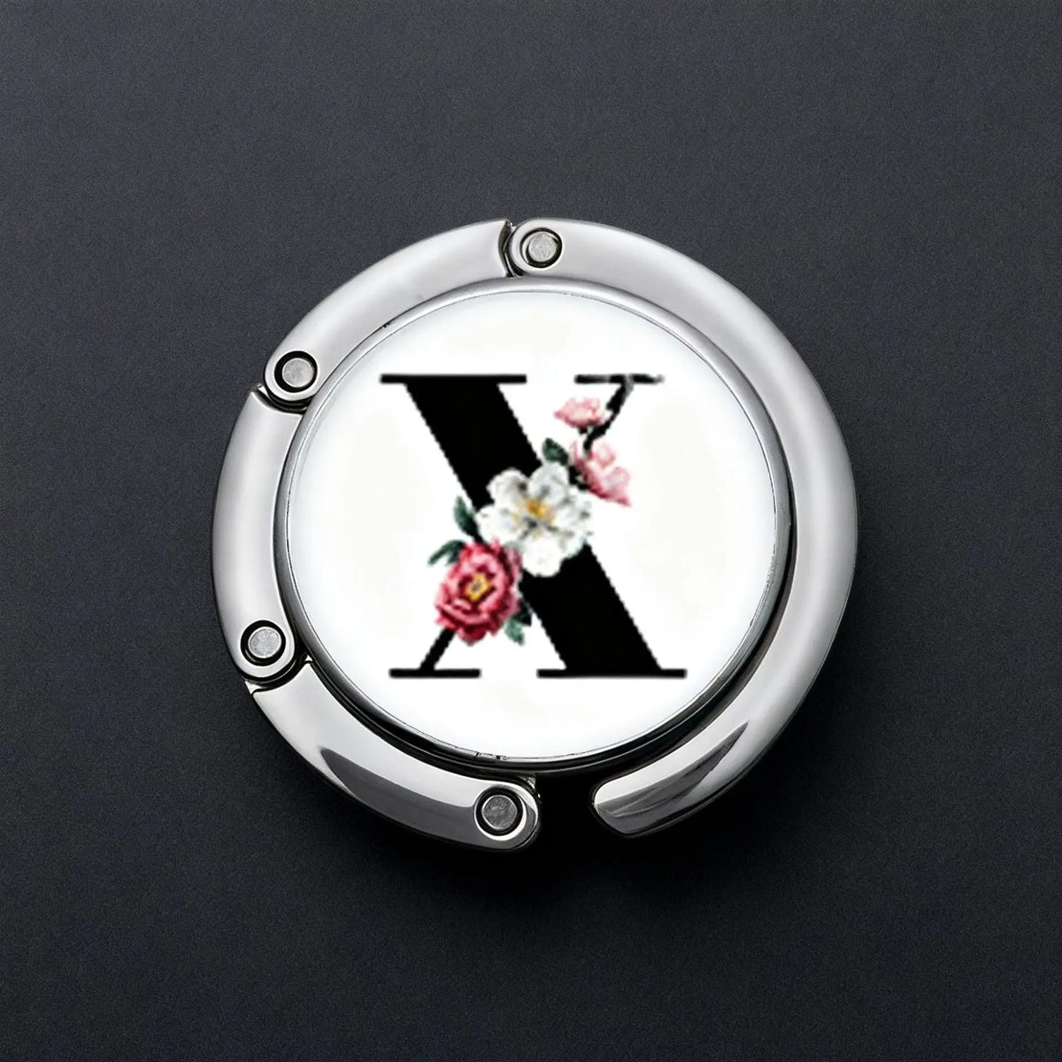 Silver foldable letter hanger hook with a black X design and pink floral accents
