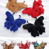A collection of decorative rhinestone butterfly appliqués and stickers in various colors like green, red, black, blue, orange