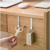 A hand is using a white hook rack to open a cabinet door, showing the multi-purpose hook rack for cabinet doors.
