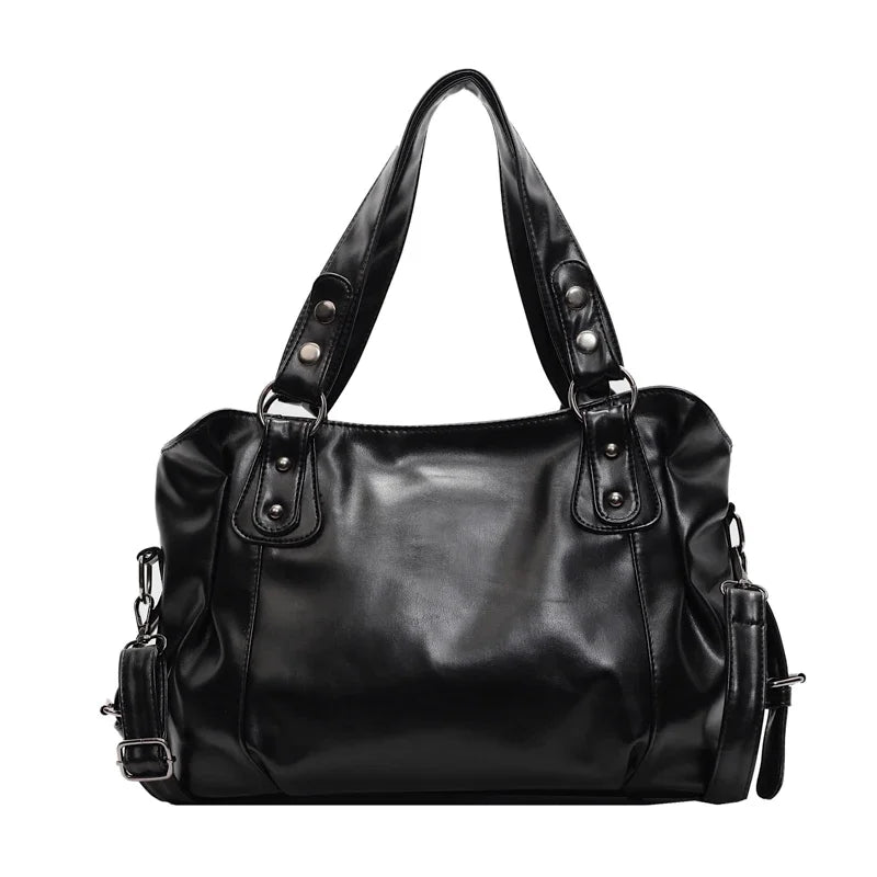 Black vintage style leather tote bag with a detachable crossbody strap.