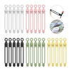 A collection of silicone cable ties and cord organizers in white, pink, black, and green colors.