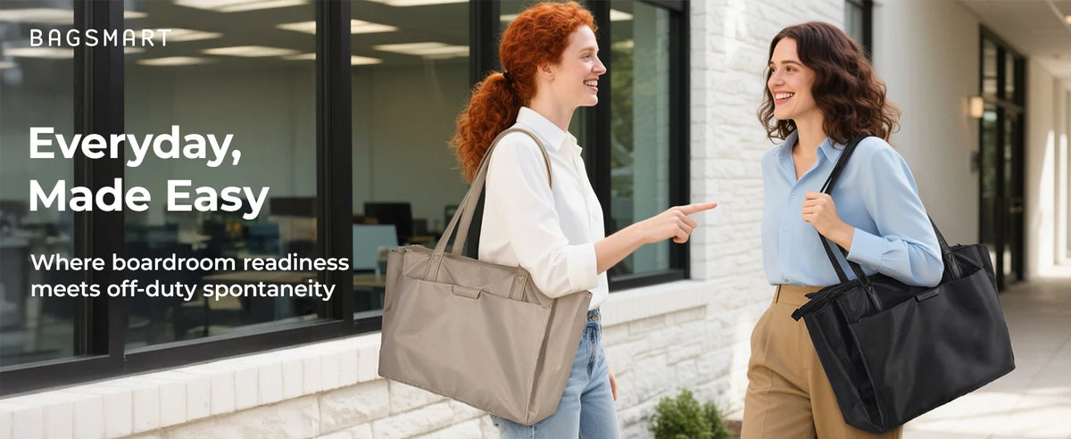 Two women are standing in a modern office setting, one pointing toward a beige laptop tote bag.