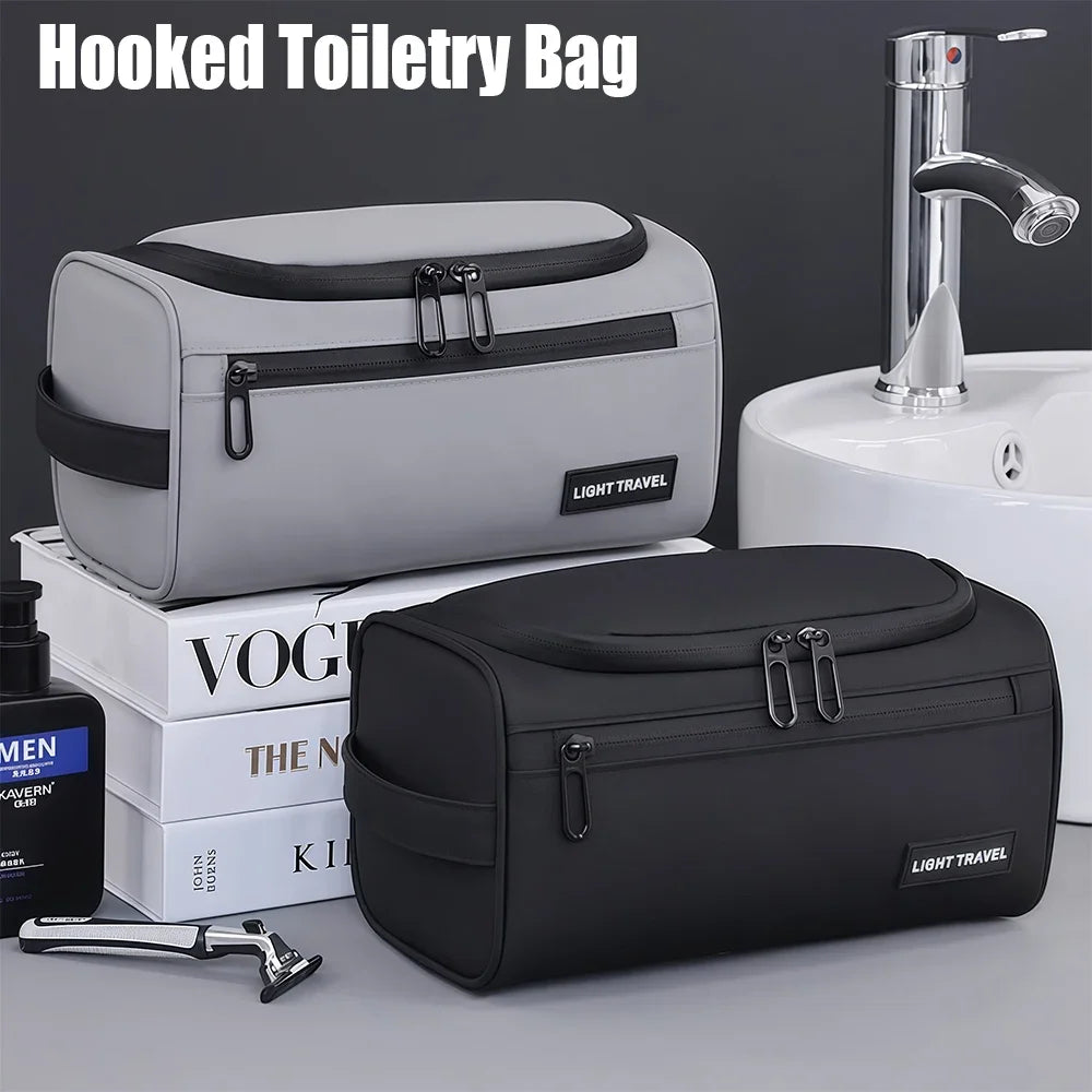 A gray hooked toiletry bag and a black hooked toiletry bag are shown next to a sink.