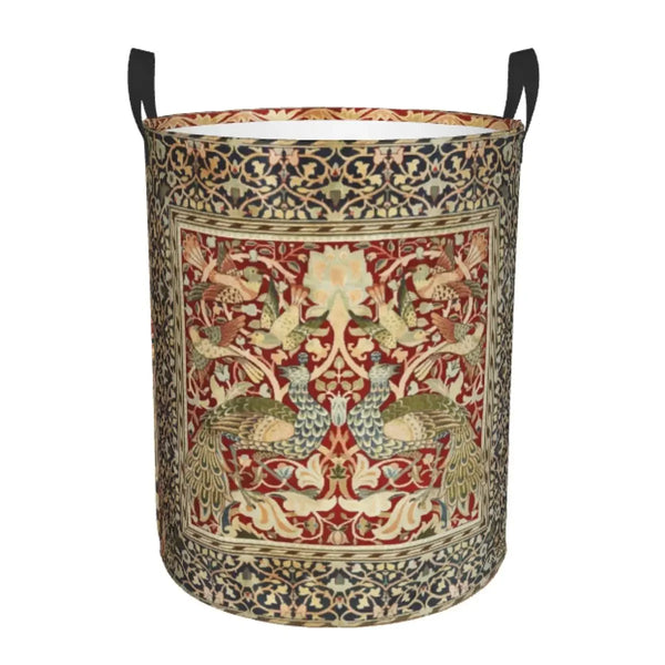 A vintage floral laundry hamper made of fabric with intricate patterns in shades of red, gold, and green.