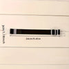 Black adjustable luggage strap measuring 3cm or 1.8 inches.