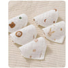 A collection of soft cotton muslin baby burp cloth towels in white with subtle floral and animal embroidery.