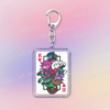 A silver keychain featuring chibi versions of K and Susie from Deltarune as poker cards.