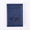 A dark blue leather passport holder with the word PASSPORT and a world map design embossed on it.