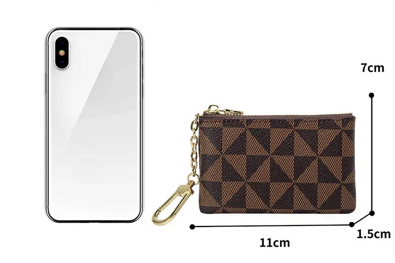 A brown geometric mini coin purse with a gold chain shown next to a smartphone for scale.