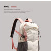 A pink and white hiking backpack with black accents displayed against a light gray background.