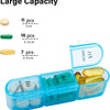 A clear blue weekly pill organizer with compartments for pills, showing various sizes and quantities.