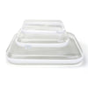 A clear plastic storage pouch with a lid resting on a transparent tray.