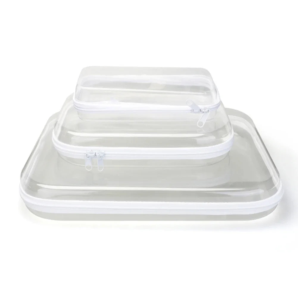 A clear plastic storage pouch with a lid resting on a transparent tray.