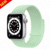 A silver Apple Watch is shown next to a light green braided stretch band.