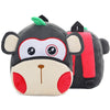 A gray and black cartoon animal plush backpack shaped like a monkey face with large eyes and red accents.