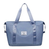 A light blue expandable travel organizer bag with padded straps and a zippered closure.
