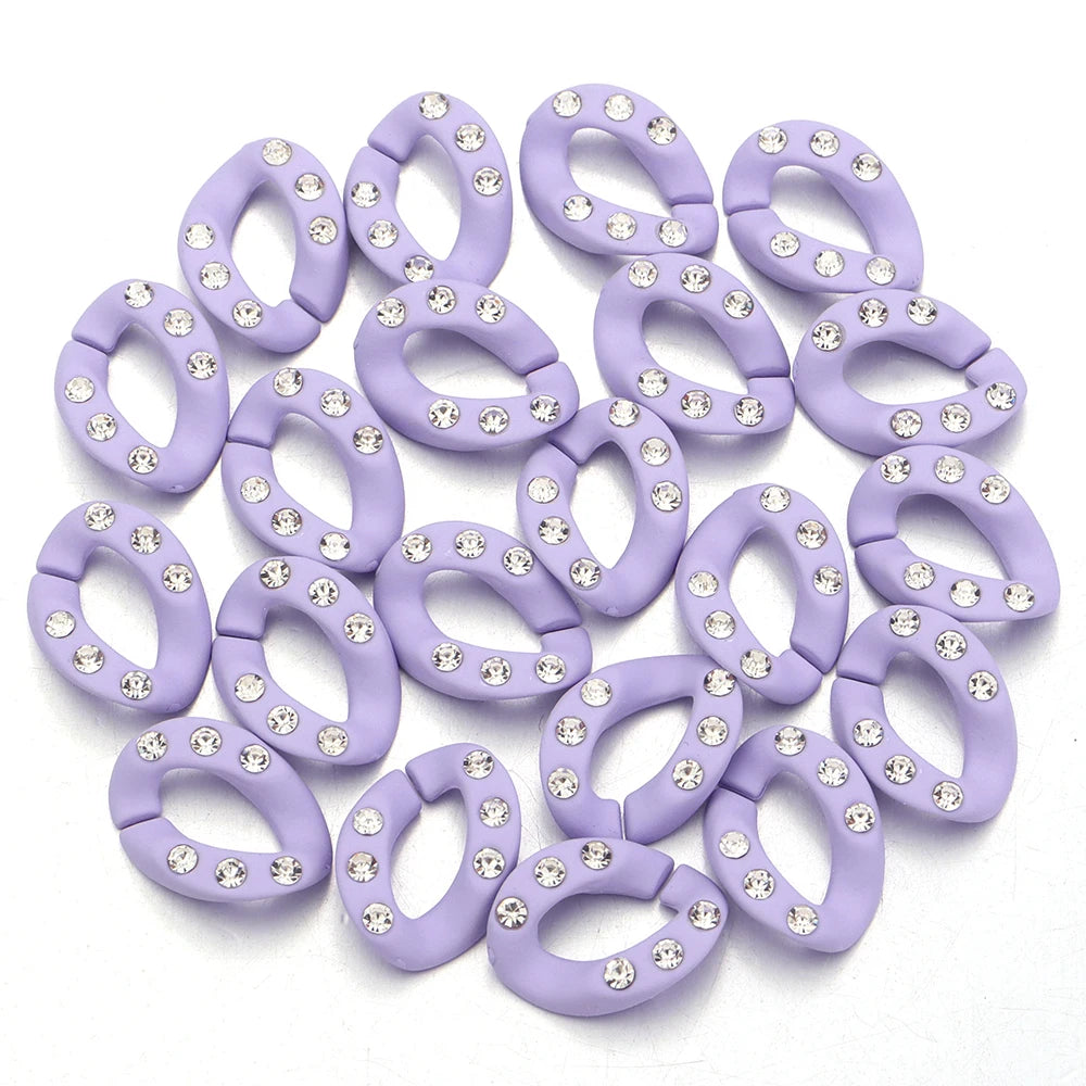 A collection of purple acrylic link chains adorned with clear rhinestones for DIY jewelry making.