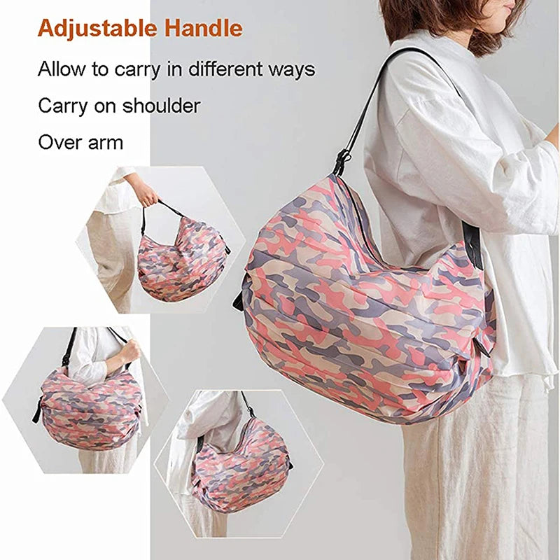 A woman is carrying a pink and green patterned foldable nylon storage bag on her shoulder or over her arm.