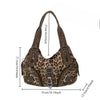 A brown leopard print crossbody shoulder bag with multiple compartments shown from the front.