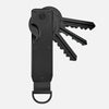 Porte-clés organisateur en métal noir minimaliste à lame divisée.