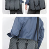 A navy blue executive PU leather laptop briefcase with a quilted pattern and black shoulder strap shown from the side.