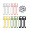A collection of silicone cable ties and cord organizers in white, pink, and yellow colors.