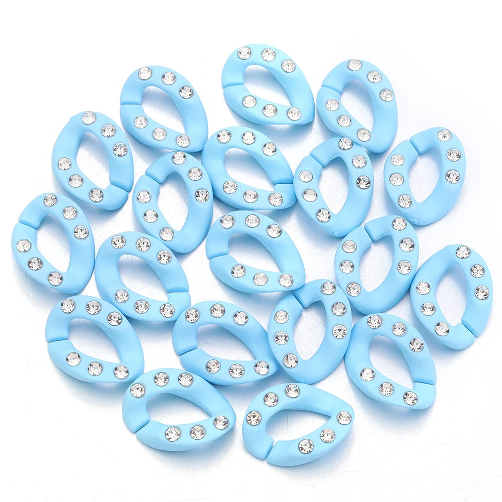 A collection of light blue acrylic link chains for DIY jewelry making