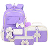 A purple and white nylon school backpack set for girls, including a backpack and a separate bag.