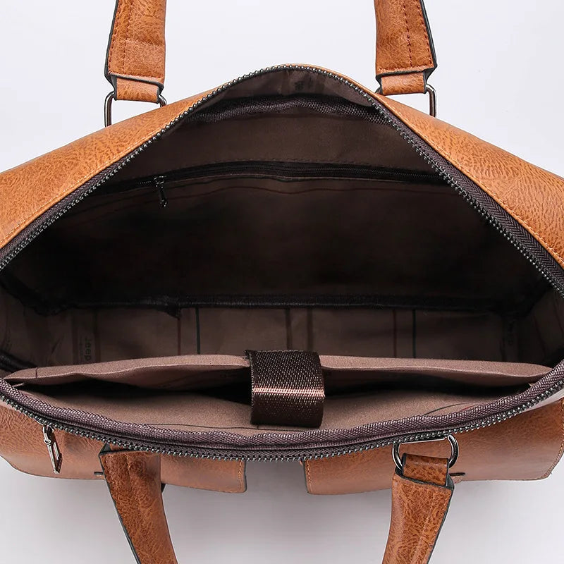 A brown men's PU leather business briefcase bag shown open, displaying the interior lining and padded straps.