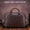 A dark brown genuine leather men's briefcase with leather straps resting on a wooden surface.